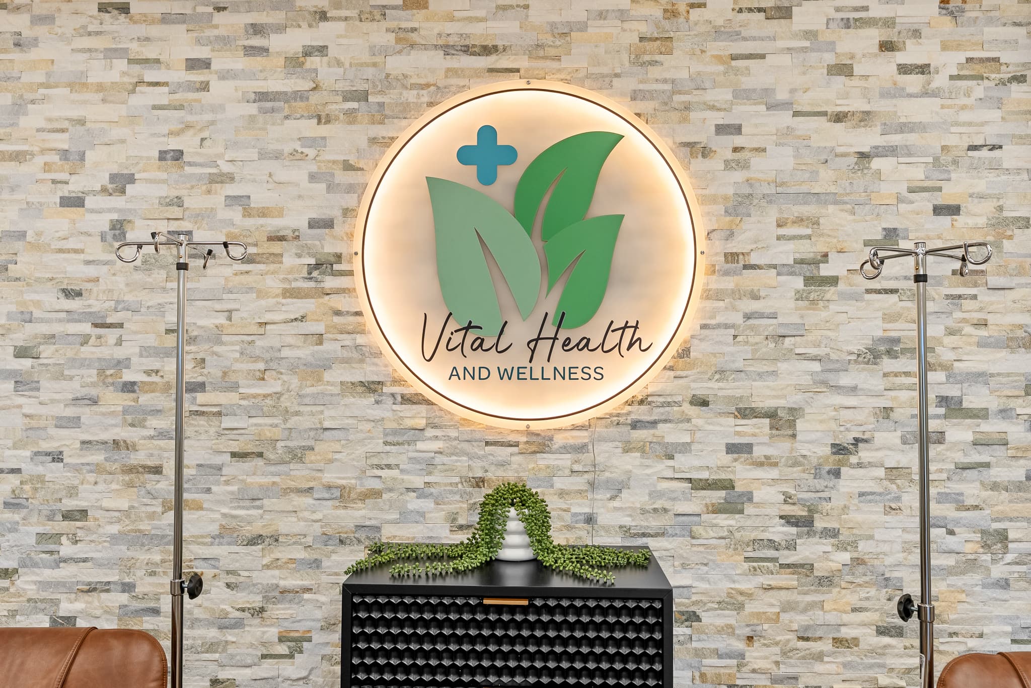 The Vital Health and Wellness branded medallion in the IV lounge